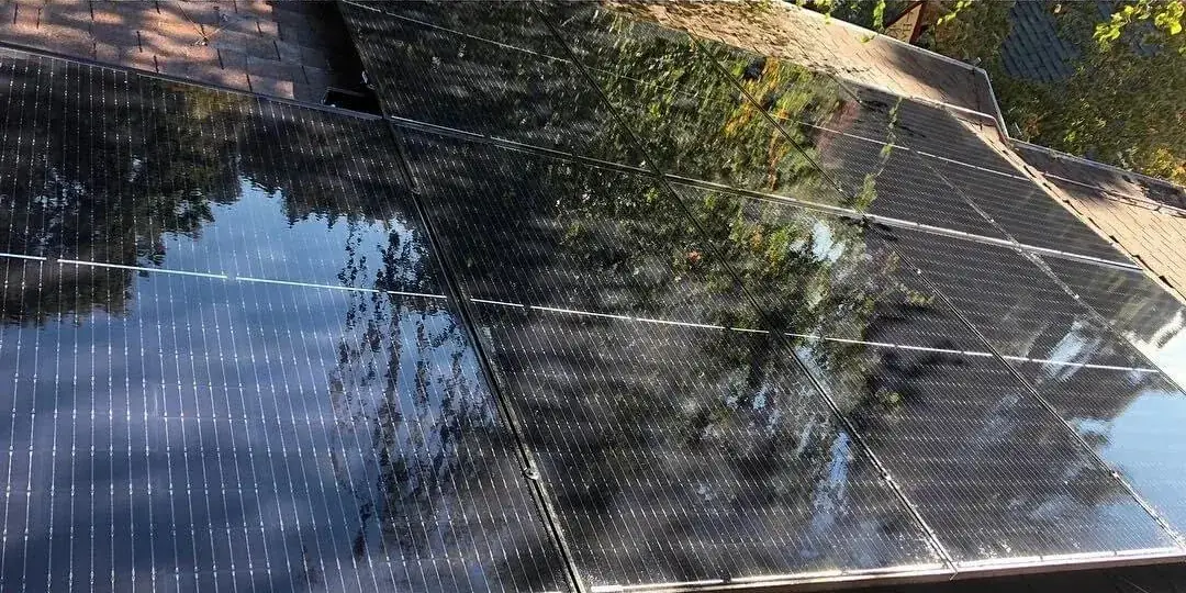 Close up of solar panels before and after cleaning